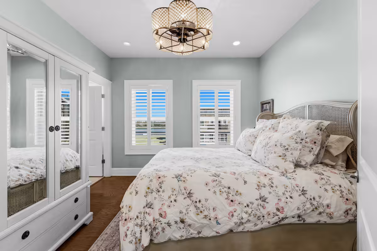 Upstairs guest bedroom with queen bed at 405 Port Street